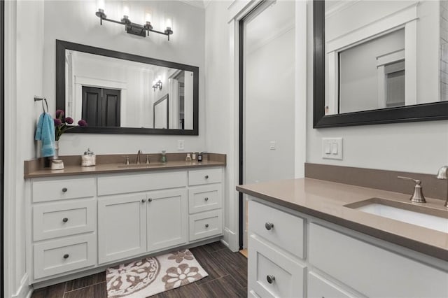 bathroom featuring vanity and ornamental molding
