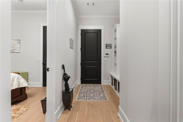 hall featuring crown molding and wood-type flooring