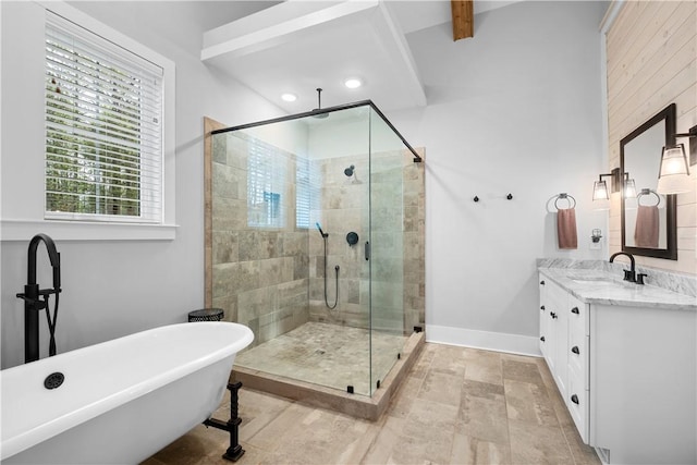 bathroom featuring a stall shower, a freestanding tub, vanity, baseboards, and recessed lighting