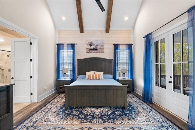 bedroom with french doors, baseboards, wooden walls, ensuite bathroom, and wood finished floors
