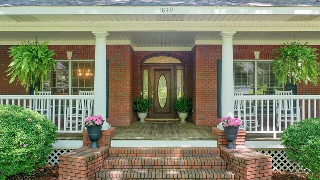 1849 Stoneridge Dr, Auburn, AL 36830 - doorway to property with covered porch and brick siding