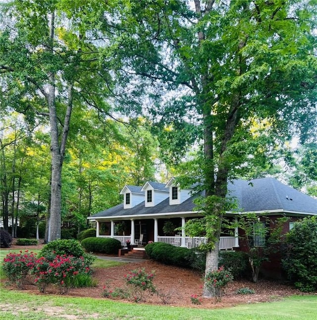 cape cod home with covered porch