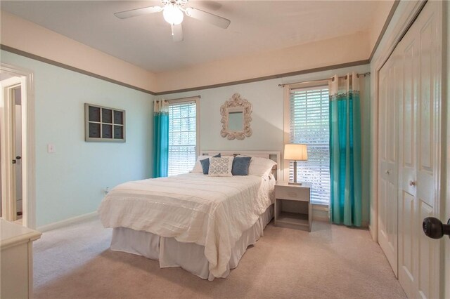 1849 Stoneridge Dr, Auburn, AL 36830 - bedroom featuring light colored carpet, a ceiling fan, and a closet