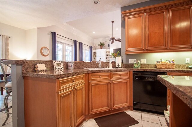 1849 Stoneridge Dr, Auburn, AL 36830 - kitchen featuring black dishwasher, a breakfast bar area, ceiling fan, a sink, and light tile patterned flooring