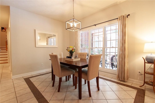 1849 Stoneridge Dr, Auburn, AL 36830 - dining space featuring light tile patterned floors, a chandelier, and baseboards