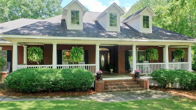 1849 Stoneridge Dr, Auburn, AL 36830 - new england style home with brick siding, a porch, and a shingled roof