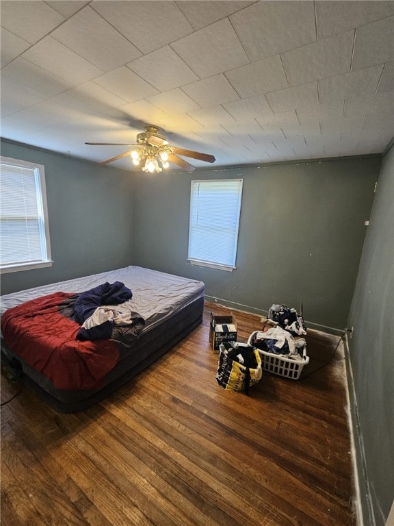 6507 22nd Ave, Valley, AL 36854 - bedroom featuring multiple windows, wood finished floors, a ceiling fan, and baseboards