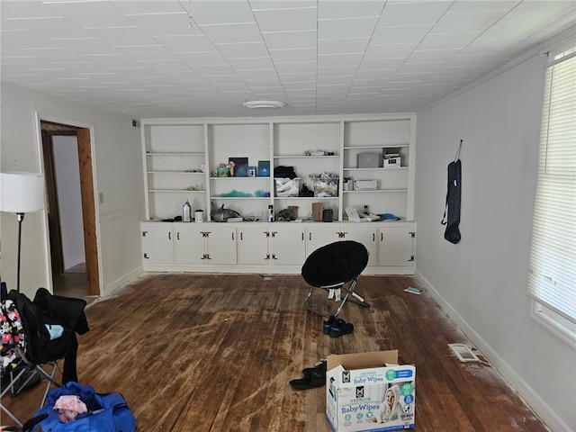 6507 22nd Ave, Valley, AL 36854 - office area with dark wood-style flooring, built in shelves, and baseboards