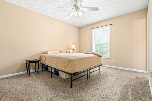 1477 N Donahue Dr Unit 2701, Auburn, AL 36832 - bedroom with a textured ceiling, carpet, and a ceiling fan