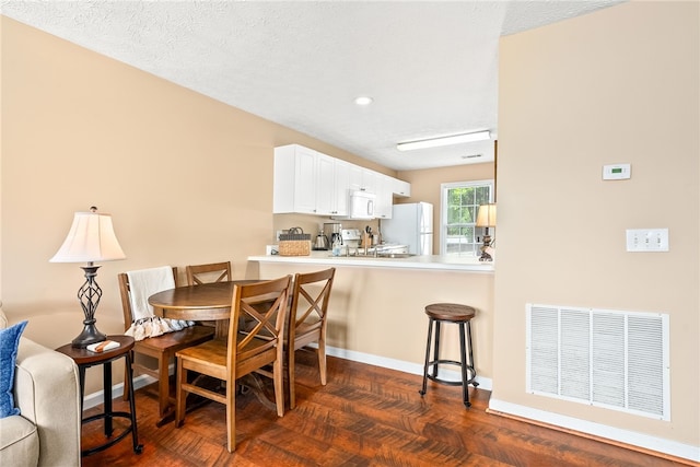 1477 N Donahue Dr Unit 2701, Auburn, AL 36832 - dining room with recessed lighting and dark wood-style floors