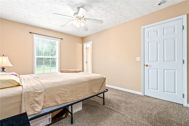 1477 N Donahue Dr Unit 2701, Auburn, AL 36832 - bedroom with carpet floors, ceiling fan, and a textured ceiling