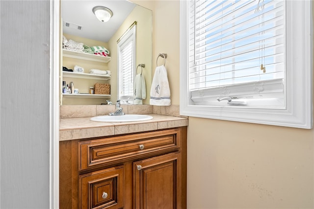 bathroom with visible vents and vanity