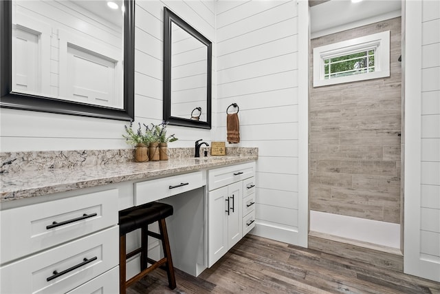 bathroom with wood-type flooring and vanity