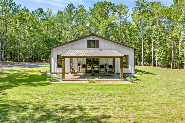 view of outdoor structure with a lawn