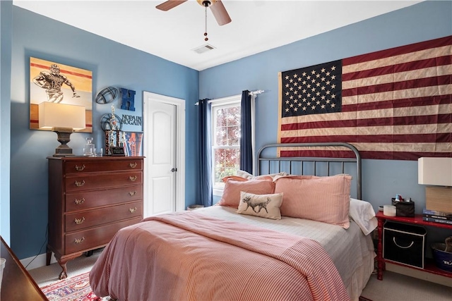 bedroom with light carpet and ceiling fan