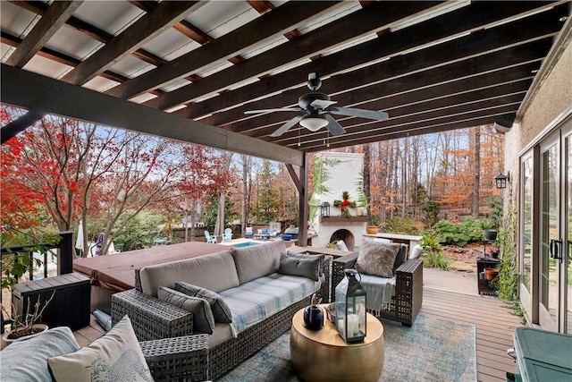 deck with an outdoor hangout area and ceiling fan