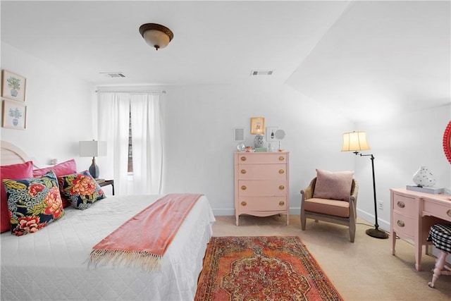 bedroom with light carpet and vaulted ceiling