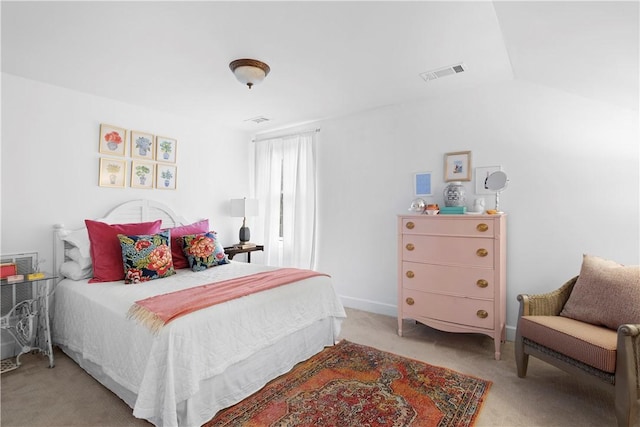 carpeted bedroom featuring lofted ceiling