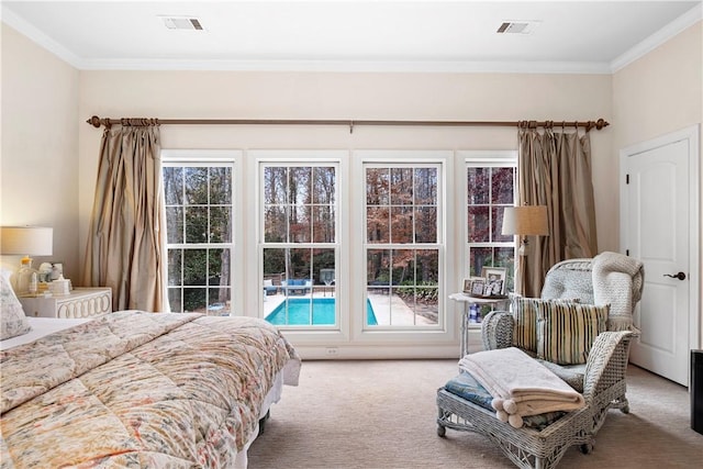 bedroom featuring crown molding and carpet floors