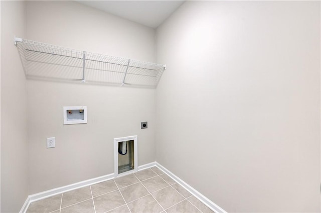 laundry area with light tile patterned floors, baseboards, washer hookup, laundry area, and hookup for an electric dryer
