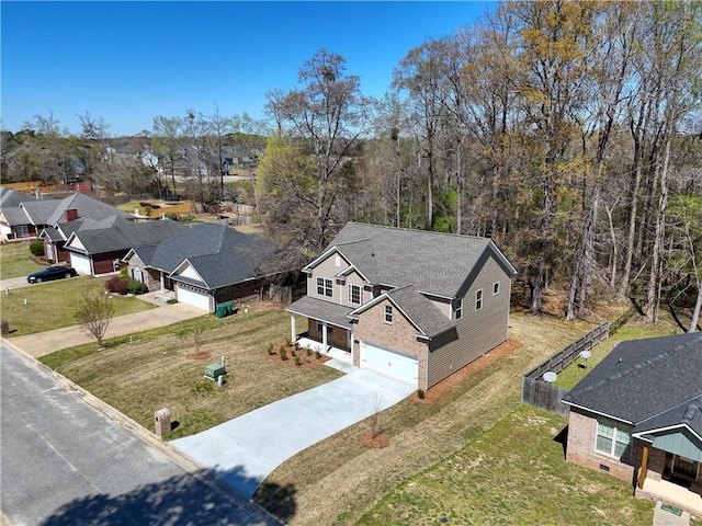 birds eye view of property with a residential view