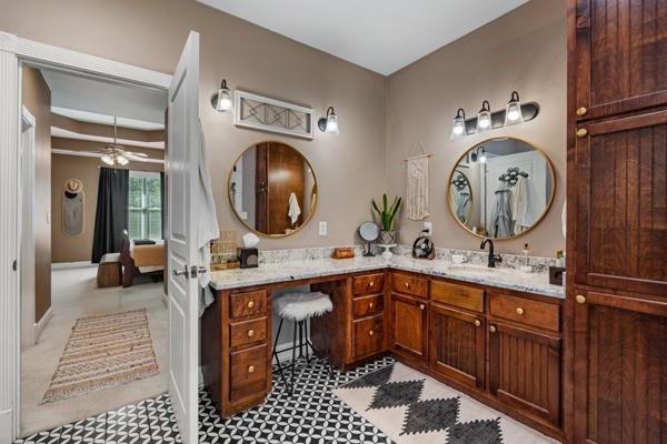 bathroom featuring ceiling fan and vanity