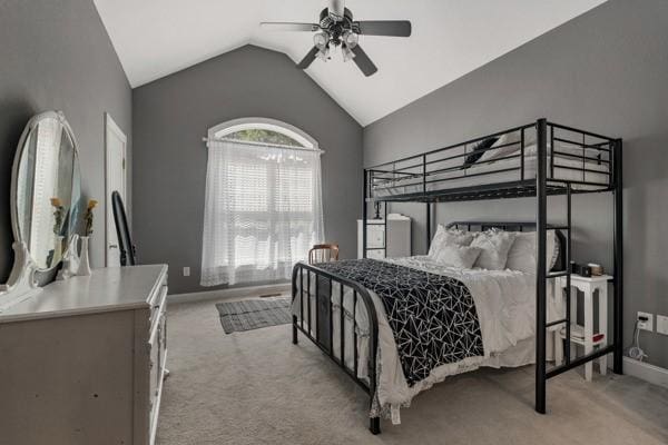 bedroom with light carpet, ceiling fan, and lofted ceiling