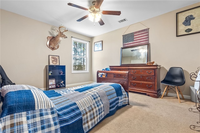 bedroom featuring carpet floors, visible vents, baseboards, and a ceiling fan