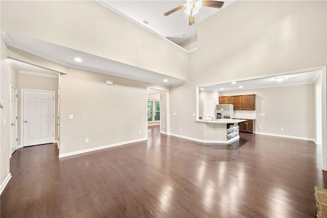 2133 W Farmville Rd W, Auburn, AL 36879 - unfurnished living room featuring ceiling fan, dark wood-style floors, crown molding, baseboards, and a sink