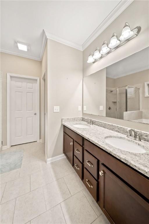 2133 W Farmville Rd W, Auburn, AL 36879 - full bathroom featuring ornamental molding, a shower stall, double vanity, baseboards, and tile patterned flooring