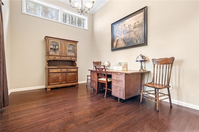 office space with ornamental molding, dark hardwood / wood-style floors, an inviting chandelier, and a towering ceiling