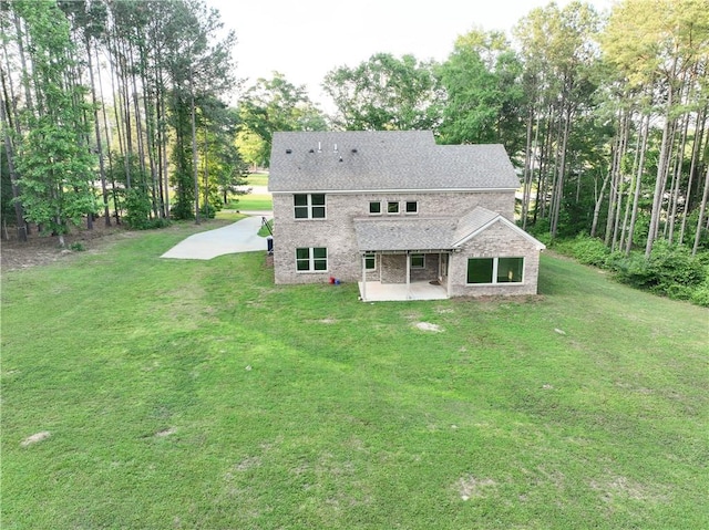 2133 W Farmville Rd W, Auburn, AL 36879 - back of house with a patio area, a yard, and view of scattered trees
