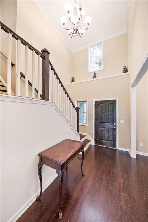 2133 W Farmville Rd W, Auburn, AL 36879 - foyer with a chandelier, stairway, plenty of natural light, hardwood / wood-style floors, and crown molding
