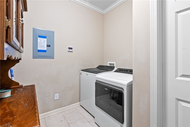 clothes washing area with laundry area, electric panel, ornamental molding, washing machine and dryer, and light tile patterned flooring