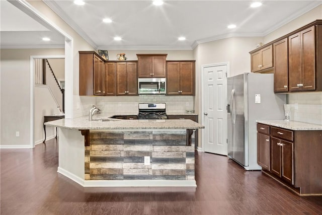 2133 W Farmville Rd W, Auburn, AL 36879 - kitchen featuring stainless steel appliances, a peninsula, light stone countertops, dark wood-style flooring, and tasteful backsplash