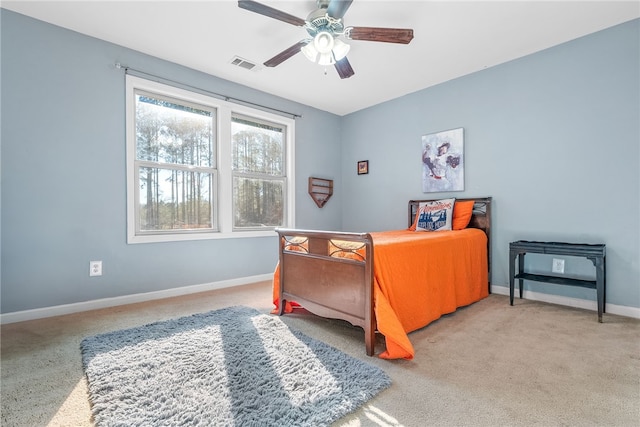 bedroom with ceiling fan, visible vents, and baseboards