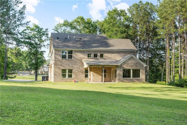 2133 W Farmville Rd W, Auburn, AL 36879 - rear view of house with a yard and brick siding