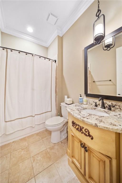 full bathroom featuring toilet, shower / tub combo, ornamental molding, vanity, and tile patterned flooring