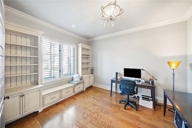 home office with ornamental molding, a notable chandelier, and light hardwood / wood-style flooring