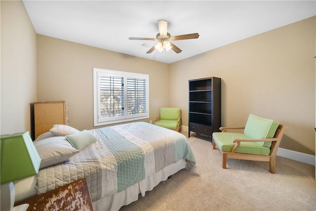 bedroom featuring ceiling fan and carpet