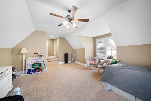 bedroom featuring light carpet, vaulted ceiling, and ceiling fan