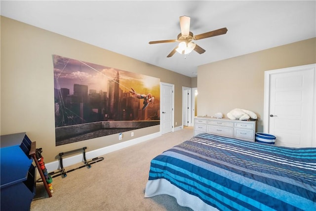 bedroom featuring ceiling fan and carpet