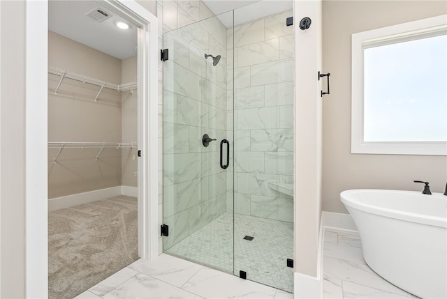 3667 Tiana Way, Opelika, AL 36801 - bathroom featuring marble finish floors, a stall shower, baseboards, and a walk in closet