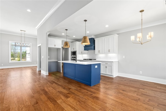 3667 Tiana Way, Opelika, AL 36801 - kitchen with a chandelier, ornamental molding, baseboards, decorative backsplash, and white cabinetry