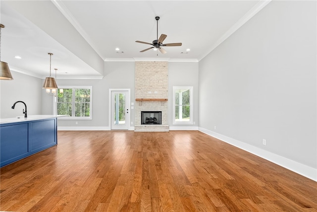 3667 Tiana Way, Opelika, AL 36801 - unfurnished living room featuring a ceiling fan, light wood-style floors, baseboards, crown molding, and recessed lighting