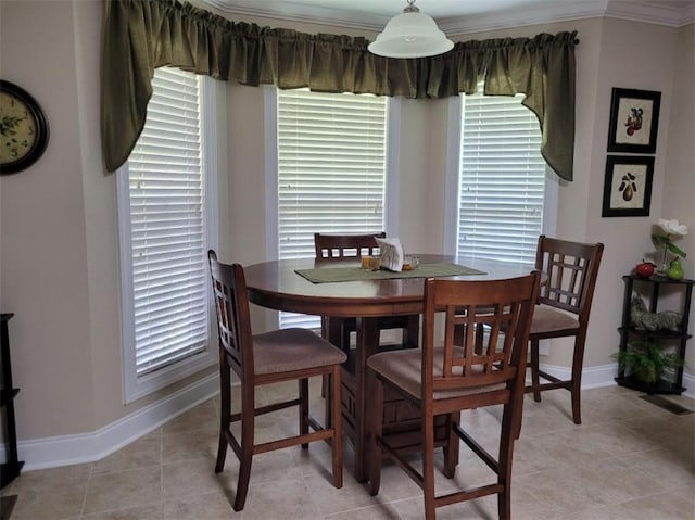 212 Melody Ln, Valley, AL 36854 - dining space with ornamental molding and light tile patterned floors