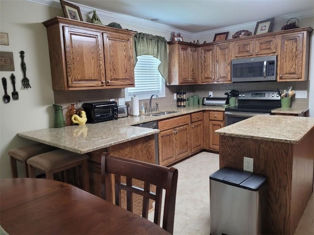 212 Melody Ln, Valley, AL 36854 - kitchen with stainless steel appliances, ornamental molding, tasteful backsplash, light stone counters, and brown cabinets