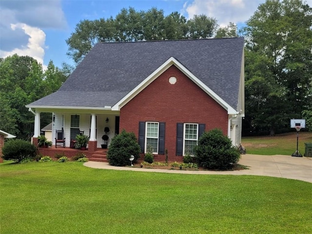 212 Melody Ln, Valley, AL 36854 - view of front of property featuring a porch, a front yard, brick siding, and driveway