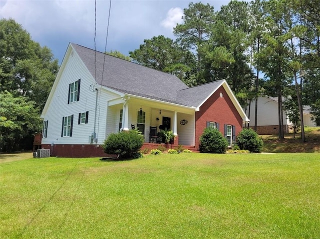 212 Melody Ln, Valley, AL 36854 - view of front of house with a porch, a front yard, and brick siding
