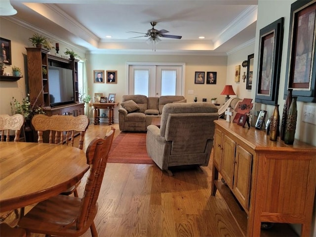 212 Melody Ln, Valley, AL 36854 - living area featuring light wood finished floors, a tray ceiling, ceiling fan, and crown molding